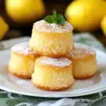 Mini Lemon Cakes Recipe, zesty, Easy to Bake 11 Mini lemon cakes cooling on rack with lemon zest